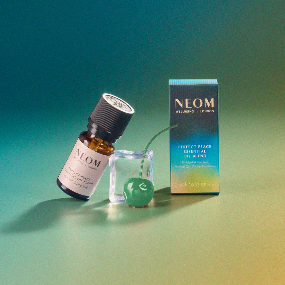 NEOM Perfect Peace bath drops creating serene soaking experience.