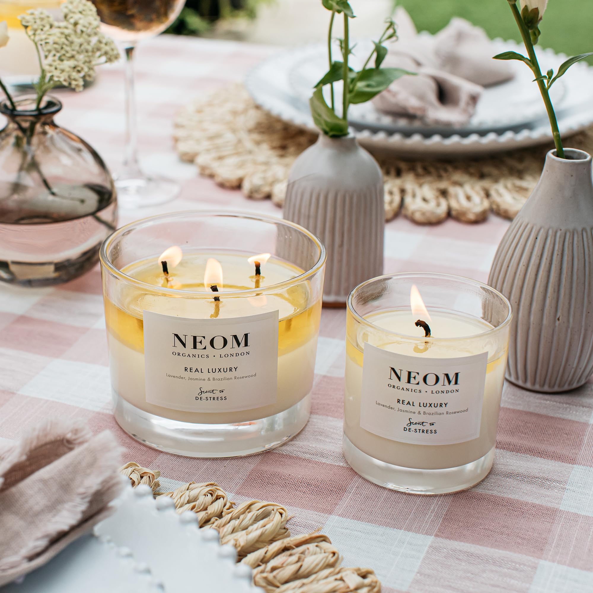 Ambient glow from the NEOM Real Luxury Candle enhances calm at home