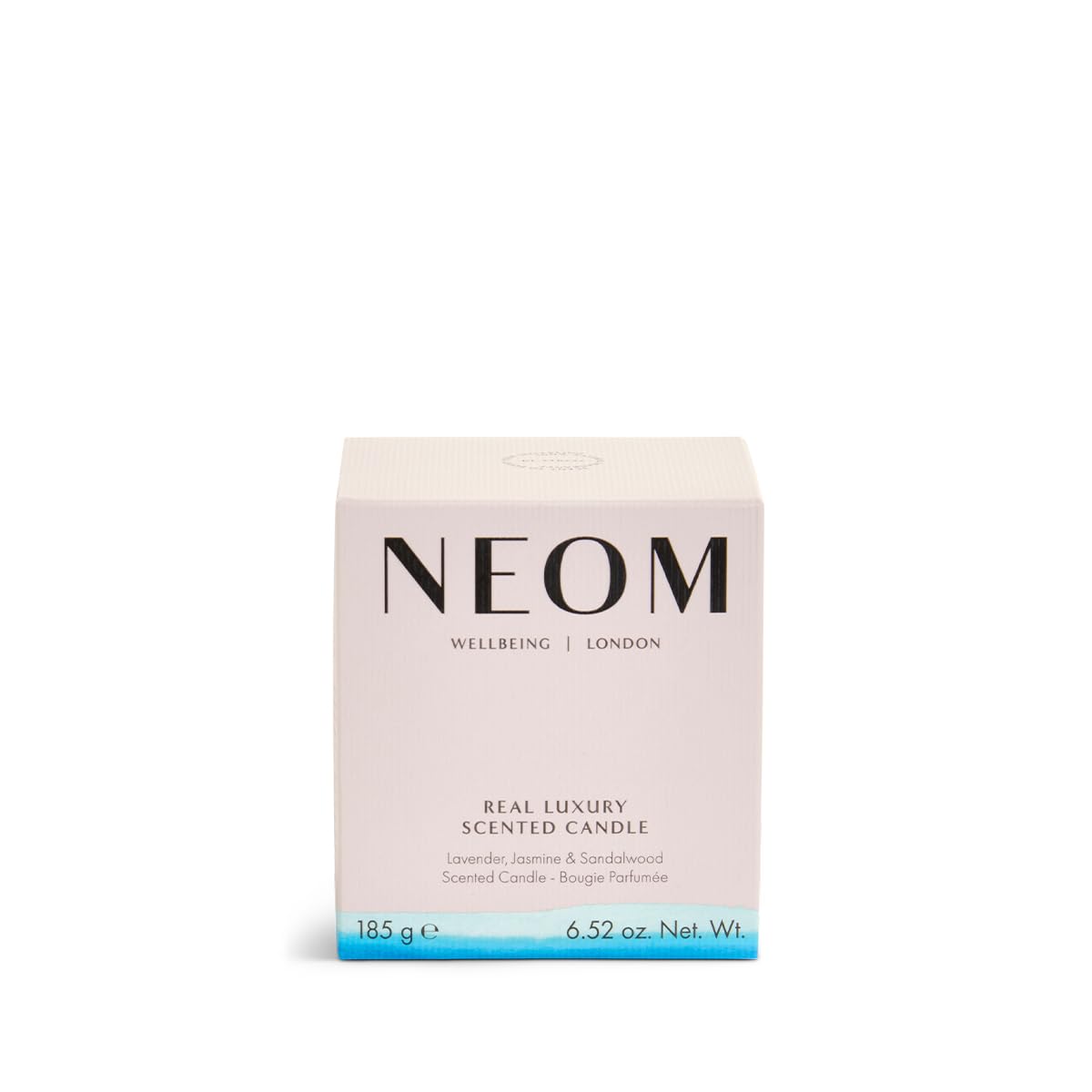 NEOM Real Luxury Candle with wax pool close-up shows premium quality