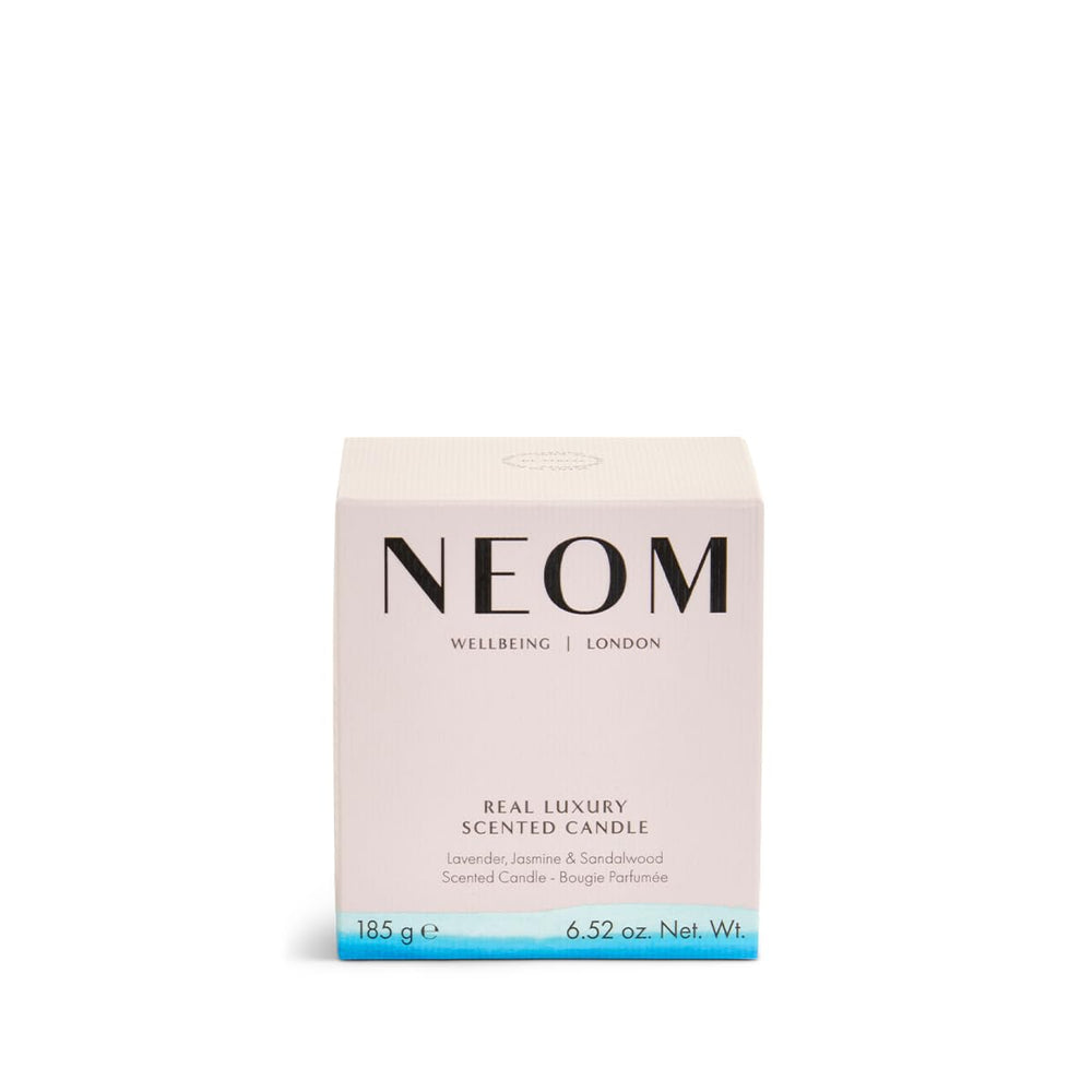 NEOM Real Luxury Candle with wax pool close-up shows premium quality