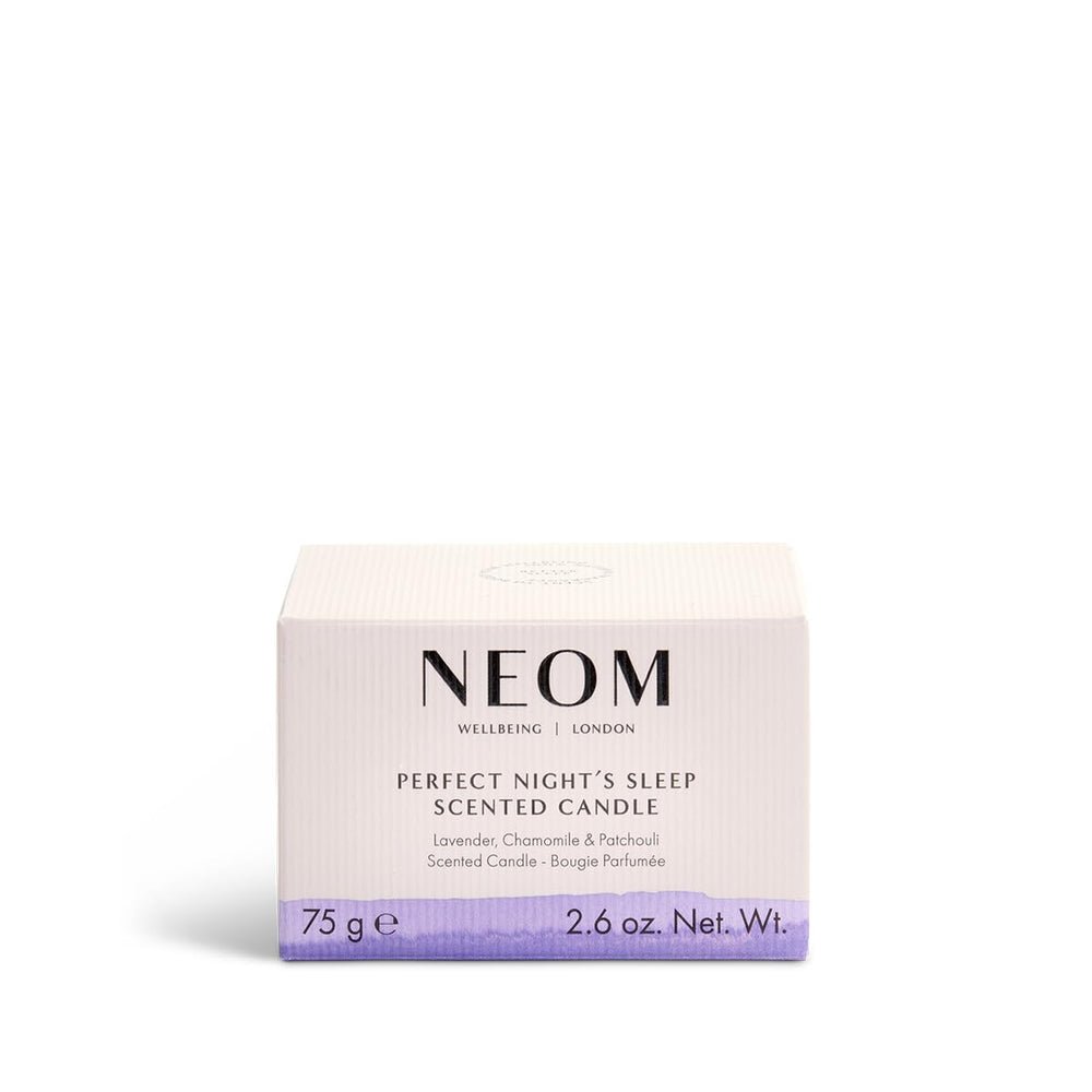 Neom travel-size sleep candle enhances calm with a dim light and soothing fragrance.