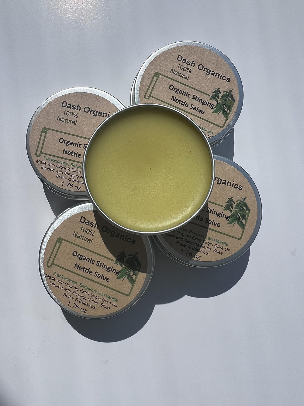 Organic Stinging Nettle Salve bottle close-up with vanilla-frankincense aroma for skin care