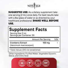 NEW AGE Cranberry Drops beside a glass of water, convenient daily use.