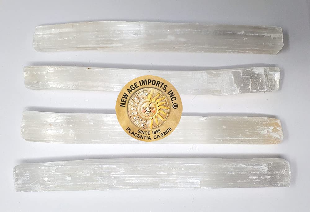 New Age Imports selenite sticks in a spa setting balance chakras gracefully.