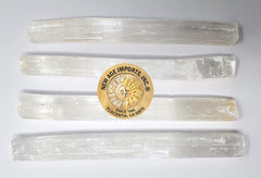 New Age Imports selenite sticks in a spa setting balance chakras gracefully.