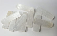 New Age Imports selenite sticks 2-3in for meditation and energy cleansing.