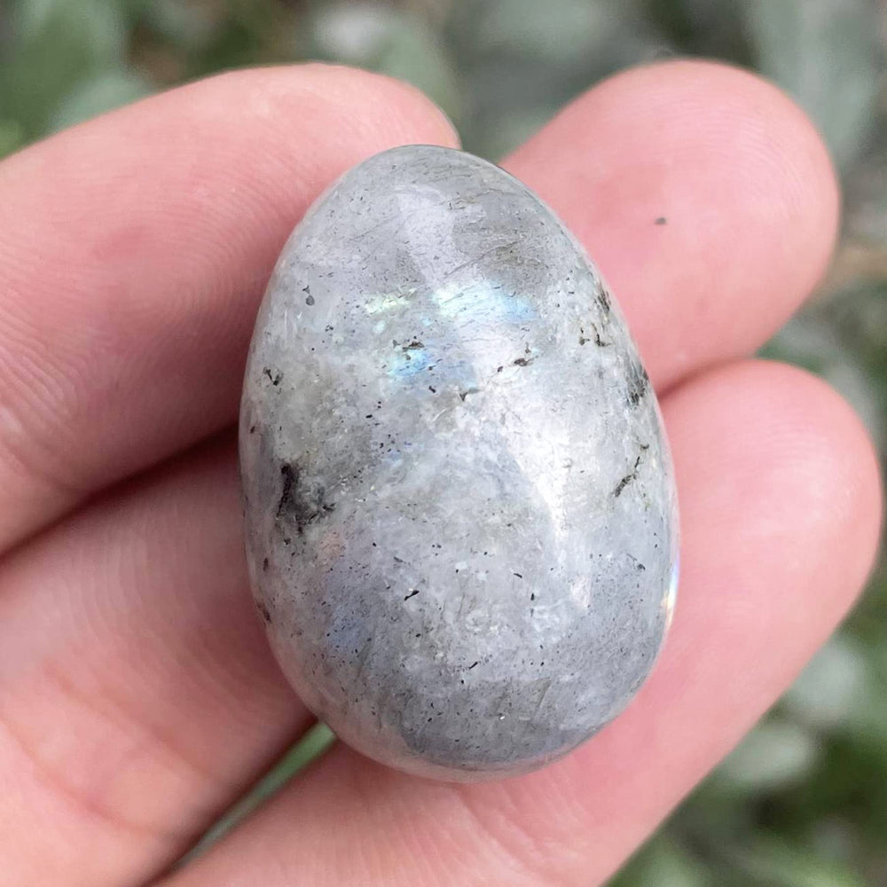 Neyisaa hand-carved stone egg showing unique vein patterns for collection.