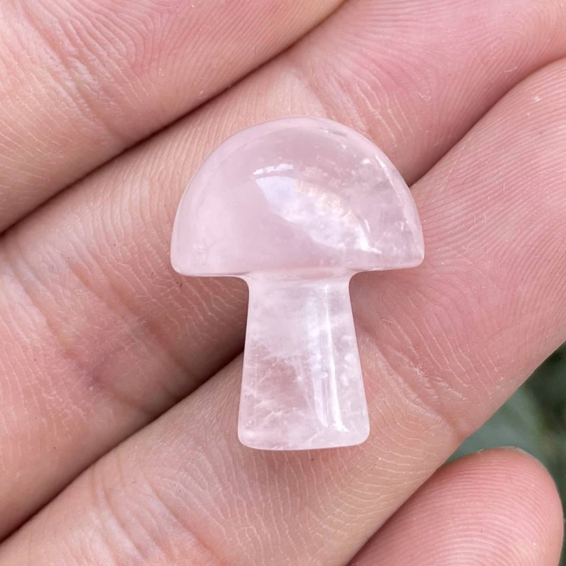 Neyisaa pocket-size rose quartz mushroom for palm holding.
