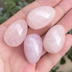 Neyisaa rose quartz mini egg in a decorative scene for feng shui balance.