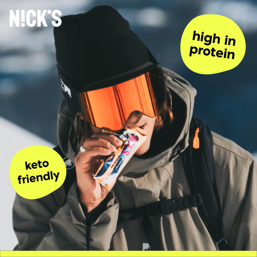 N!CK'S Nick's Protein Bars texture close-up showing chewy bite.