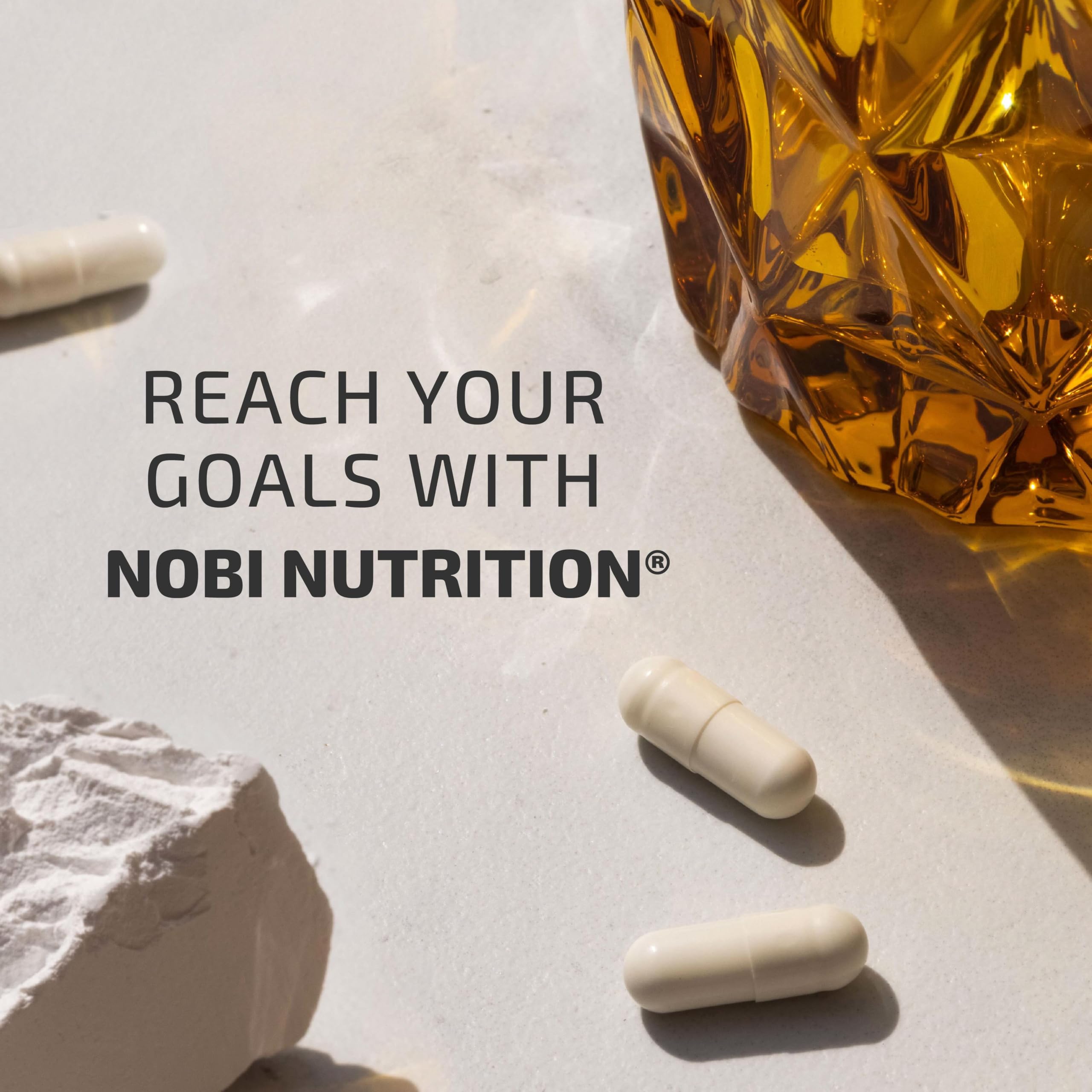 Nobi Nutrition pills in hand illustrating convenient daily supplementation.