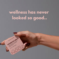 NOOZ Probiotic Mints tin open, displaying sugar-free mints for fresh breath.