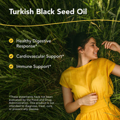 Pouring North American Herb & Spice black seed oil for everyday meals