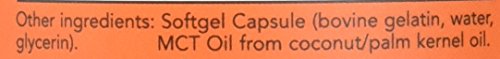 Now Foods Caprylic Acid bottle on kitchen counter, everyday supplement.