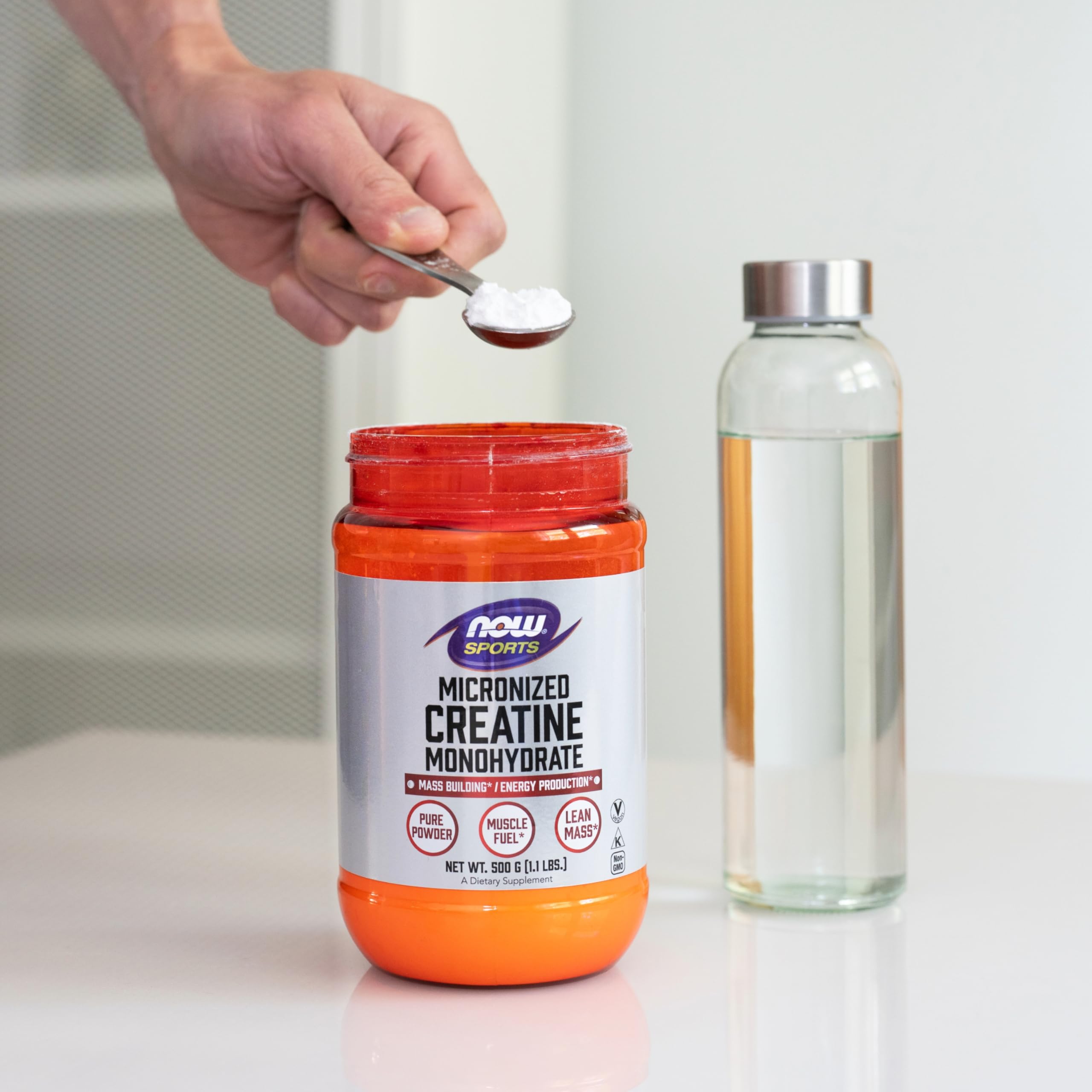 NOW Foods Creatine Powder ready for workouts in a convenient kitchen container.