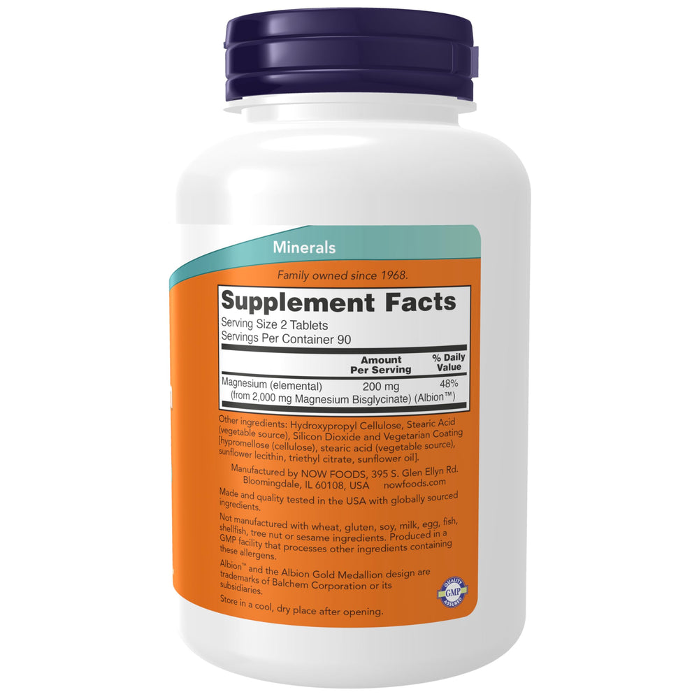 NOW Foods Magnesium Glycinate tablets closeup showing small, easy-to-swallow forms