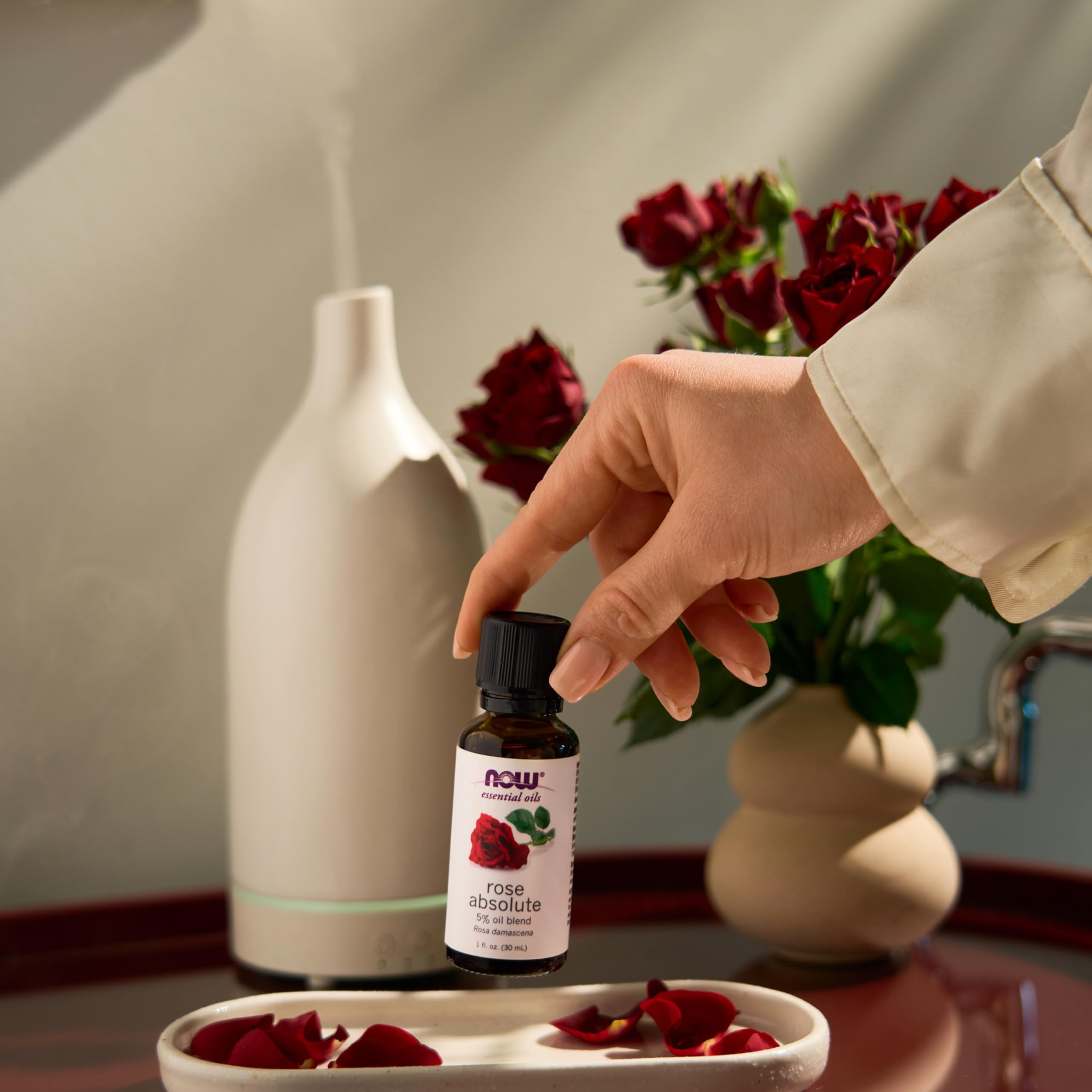 Product dropper close-up for precise measurement of Rose Absolute