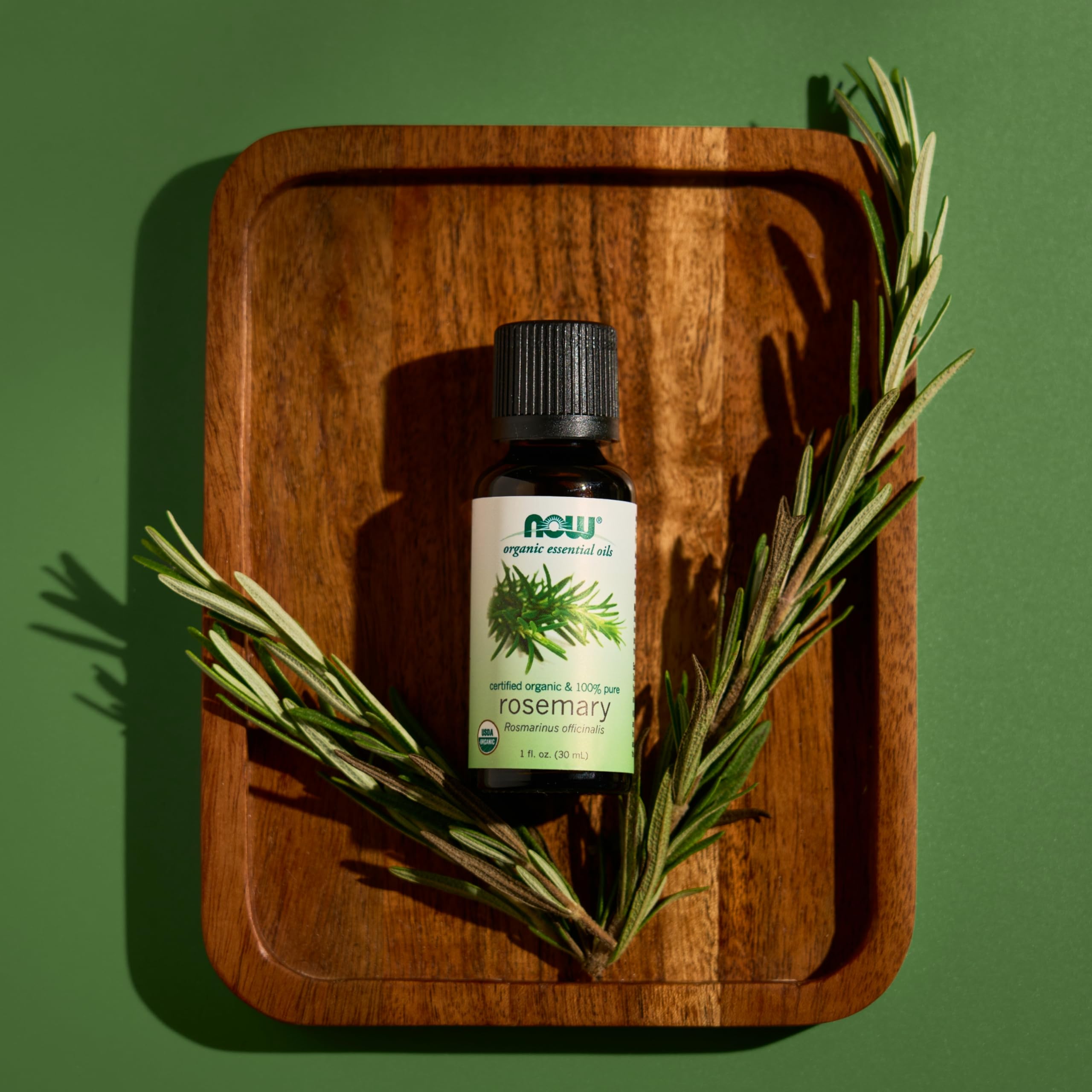 NOW Foods rosemary oil amber glass bottle indicating UV protection and purity