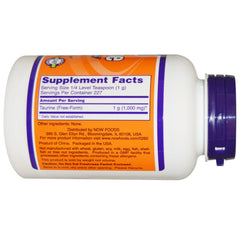 NOW Foods Taurine powder with measuring scoop for precise servings.