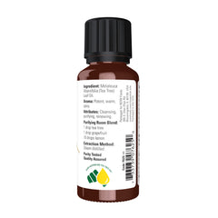 NOW Foods Tea Tree Oil bottle beside a diffuser for clean, uplifting ambiance.