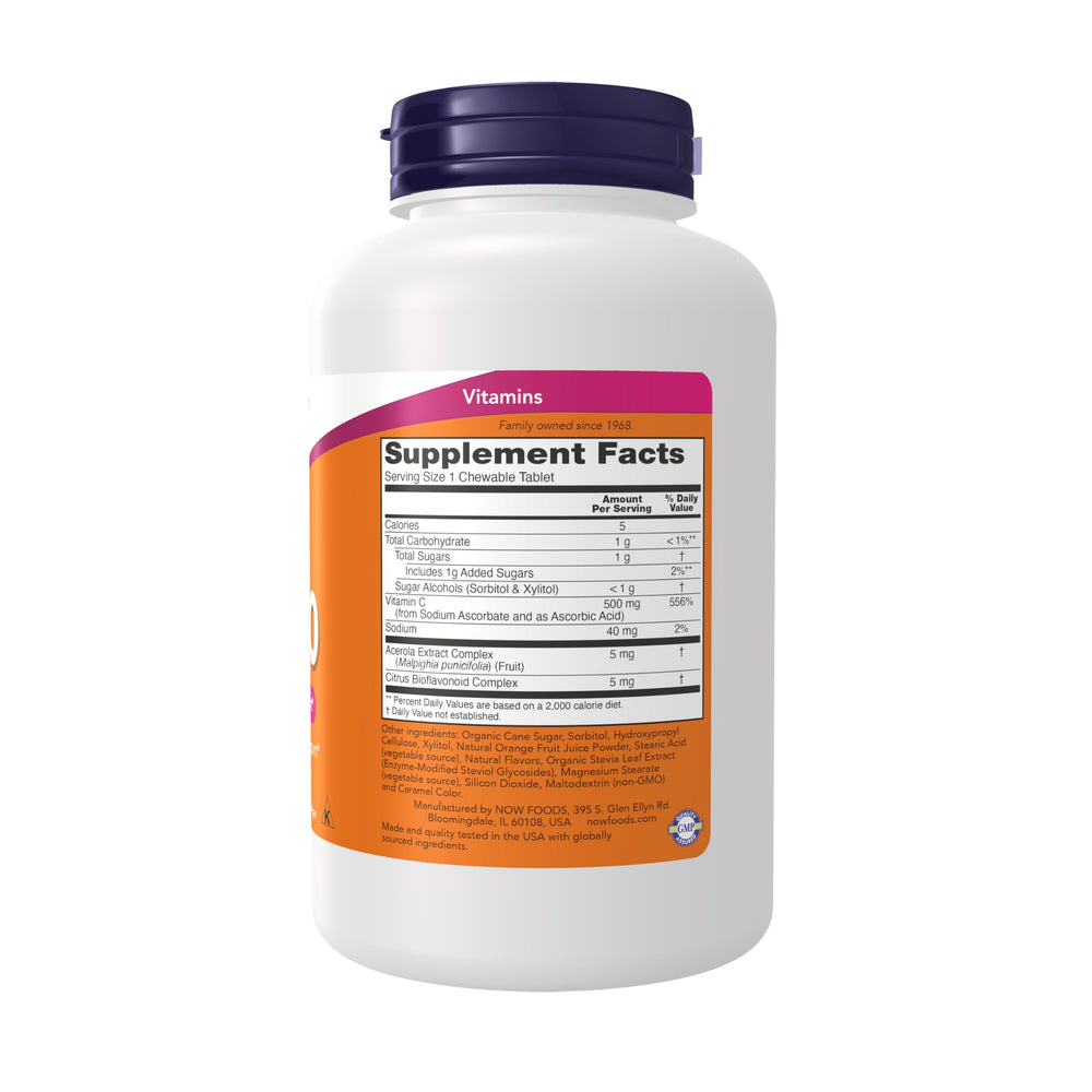 Close-up of NOW Foods Vitamin C-500 chewable tablet with bright orange flavor.