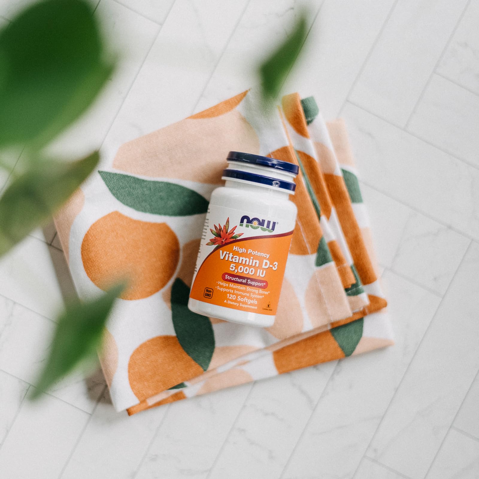 NOW Foods Vitamin D-3 5,000 IU on bottle with sun motif hinting sun-derived source