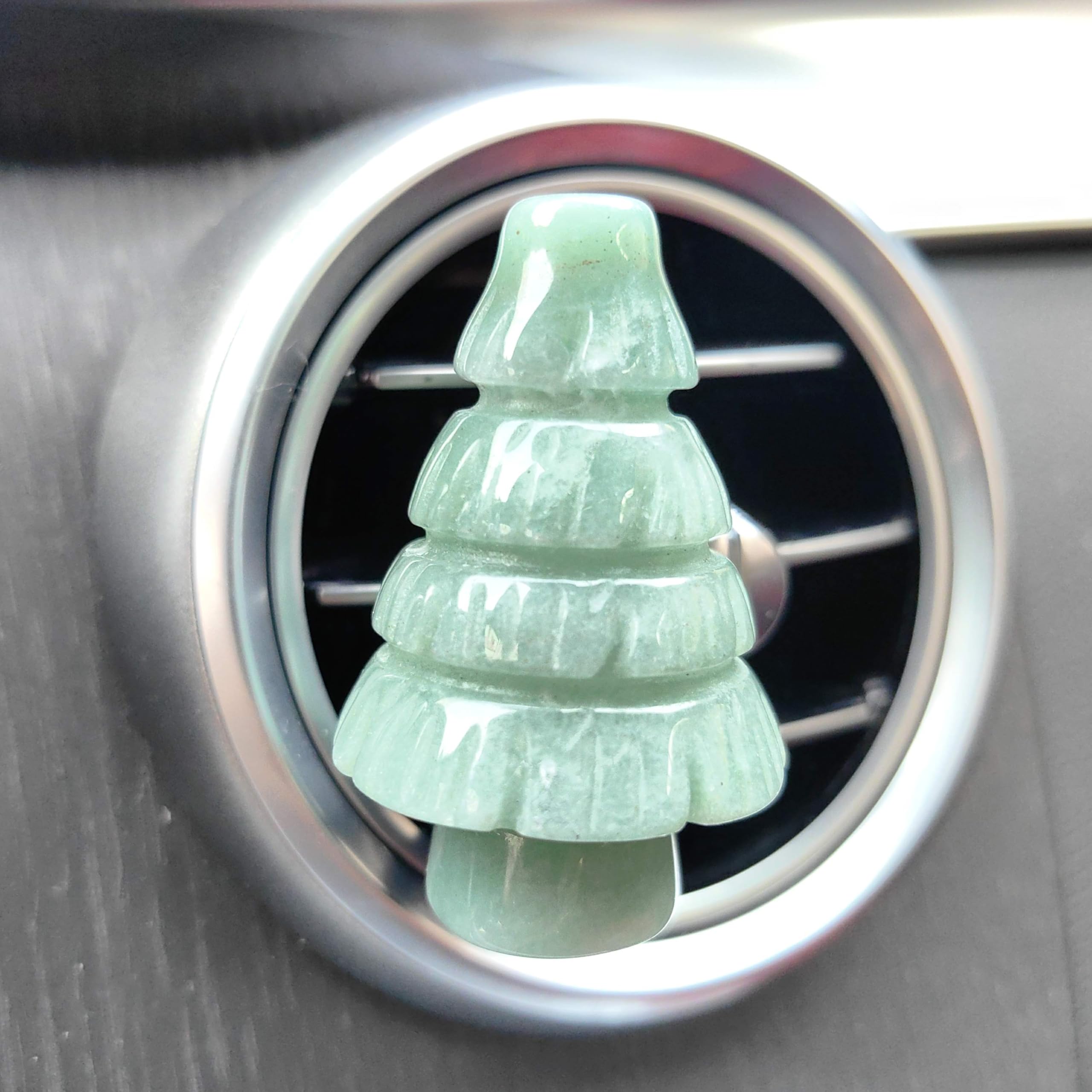 NsmjodStone Rose Quartz Tree crystal detail on a car vent clip.
