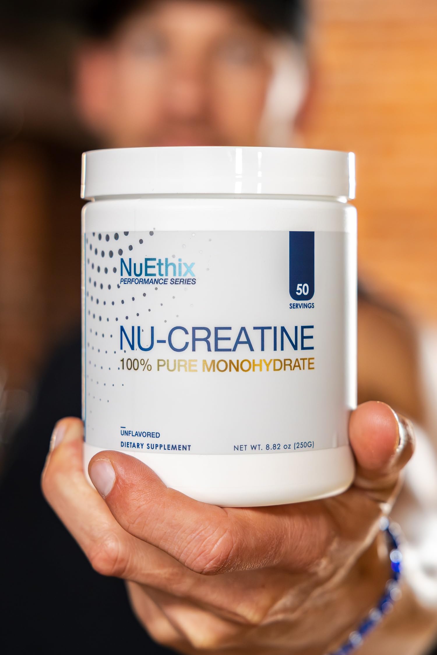 NuEthix Nu-Creatine Pure Monohydrate jar-label closeup highlights third-party testing and standards.