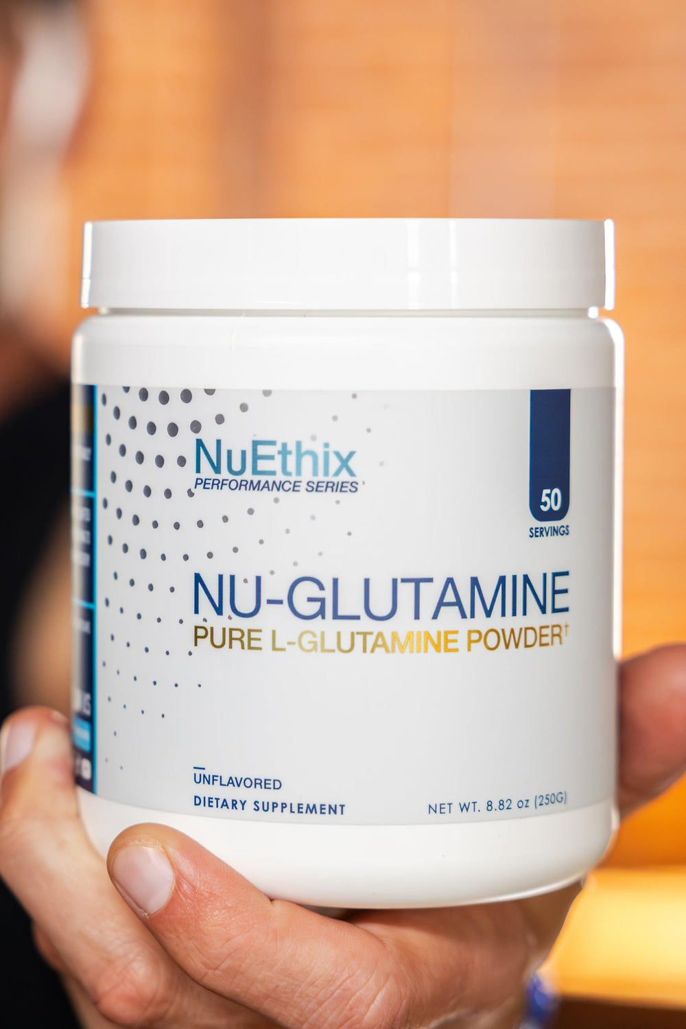 Dissolving Nu-Glutamine powder in liquid for smooth mixing.