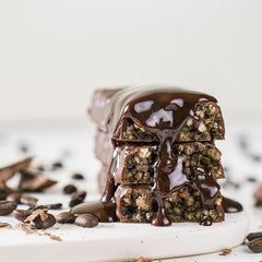 NuGo Slim bar texture close-up emphasizes creamy chocolate coating.
