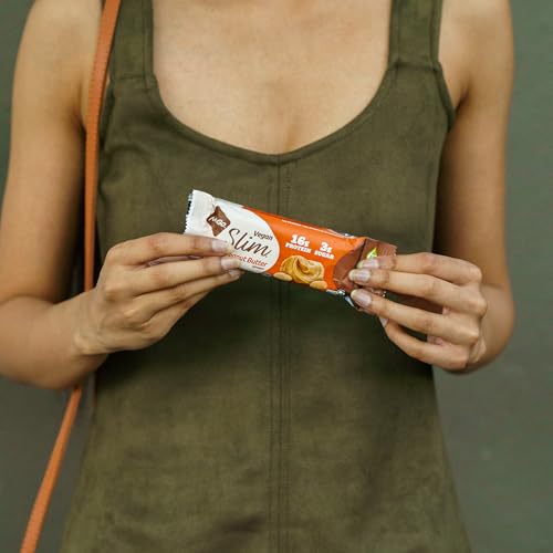 NuGo Slim close-up texture shows crunchy peanut bits and chocolate coating.