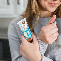Close-up of toasted coconut and dark chocolate coating on NuGo bar.