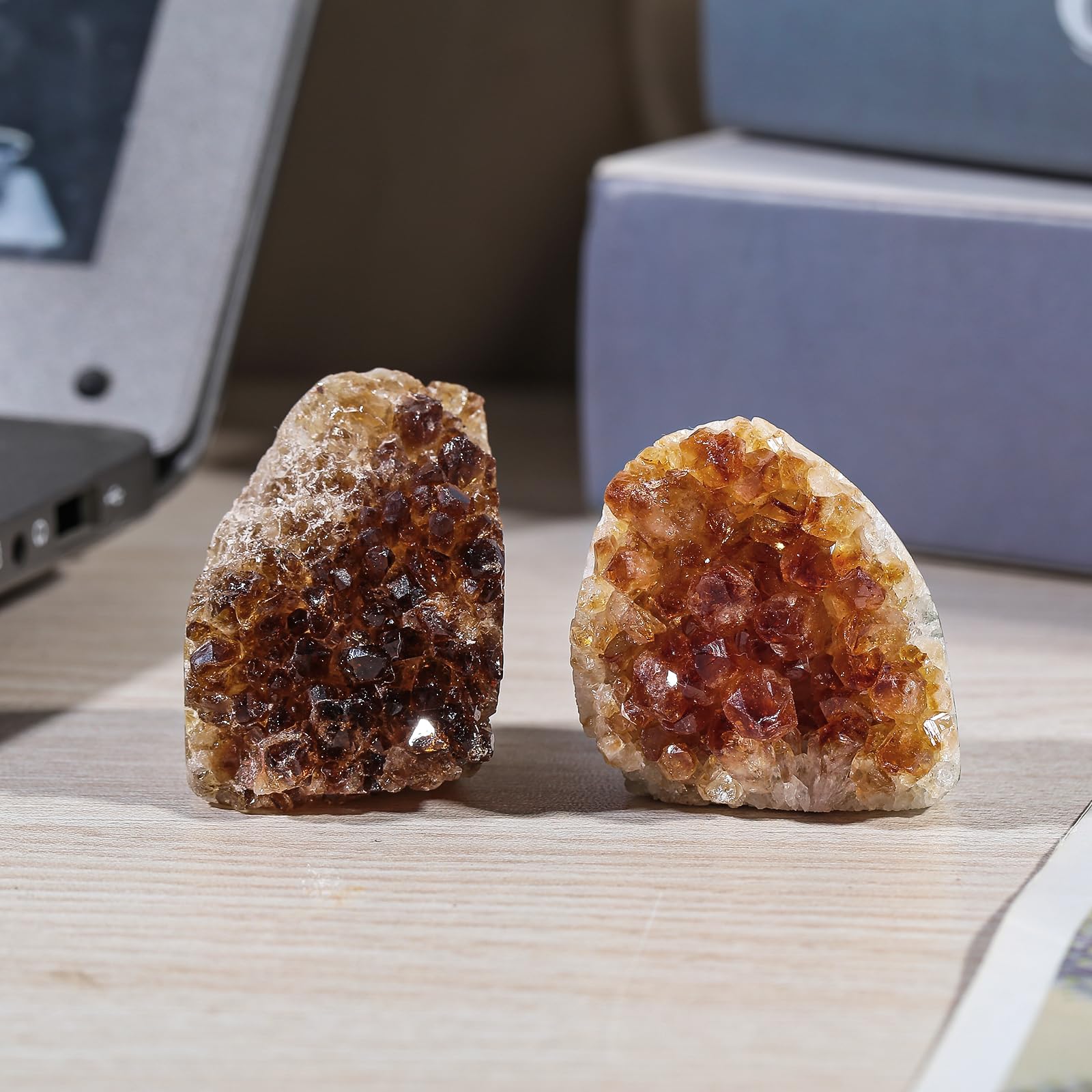 Nupuyai citrine geode cluster with drusy texture for display.