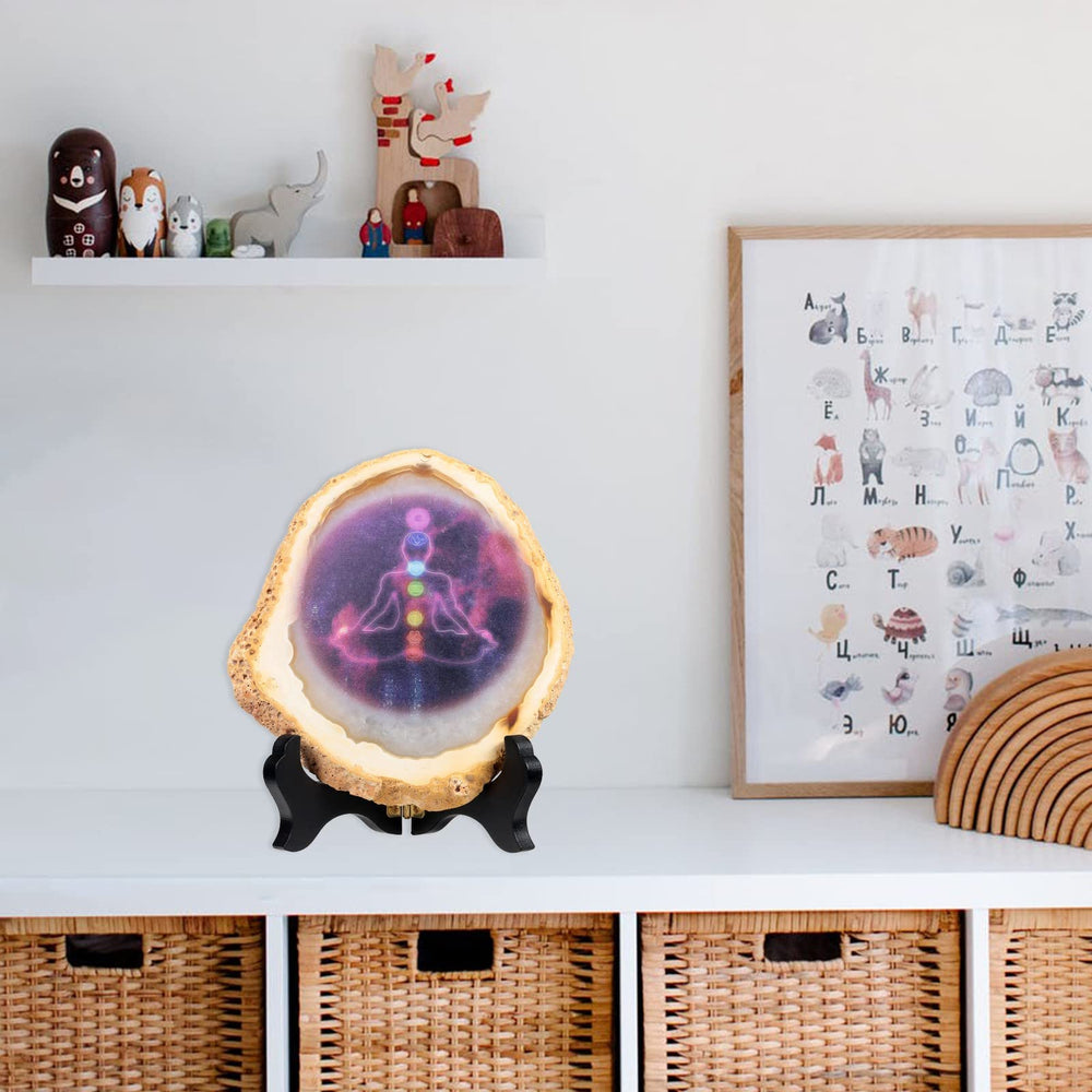 Nupuyai yoga meditation display features chakra diagram on polished stone