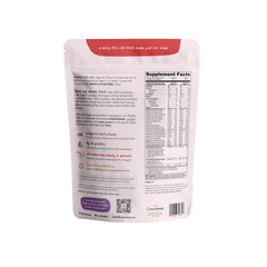 Nurished Mighty Strawberry Milk spoon scooping powder for easy mixing.