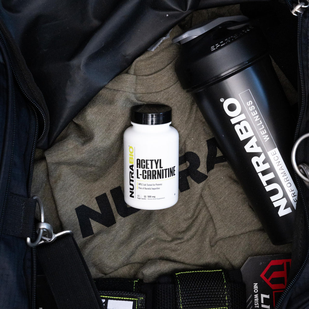 NutraBio Acetyl L-Carnitine in gym bag ready for workouts.