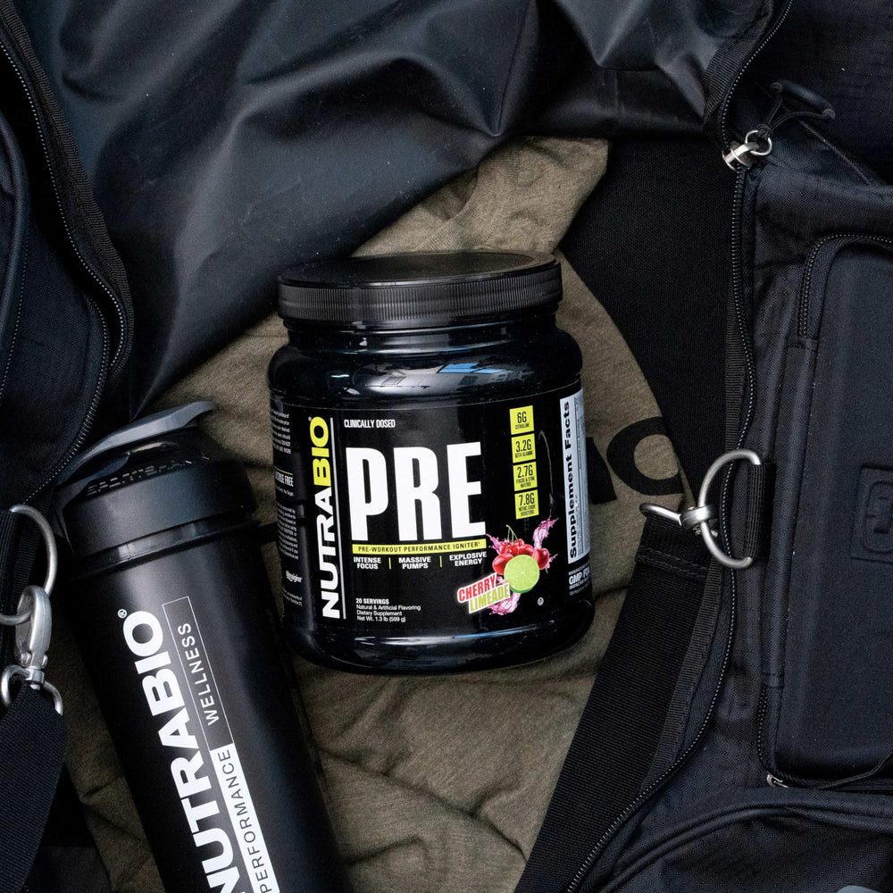 NutraBio PRE Workout old formula glass shows cherry limeade hydration during sessions.