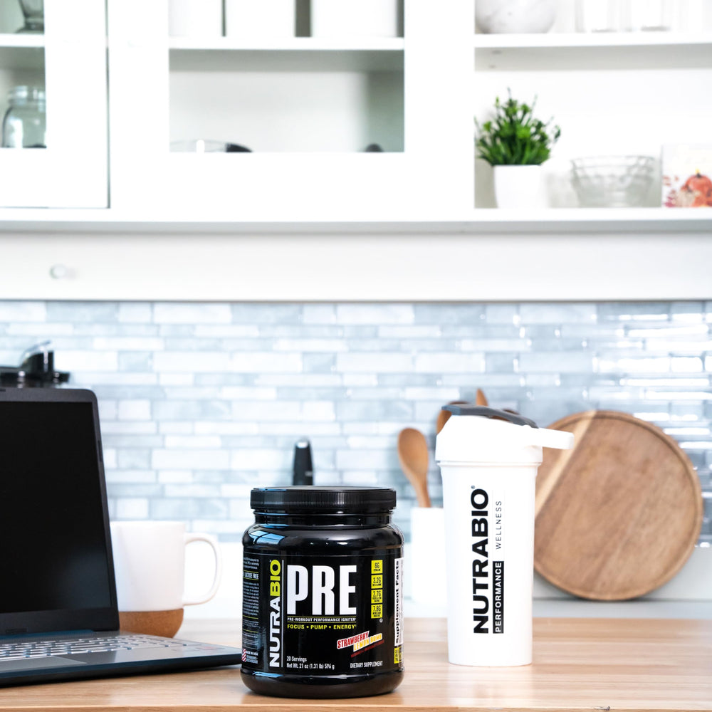 NutraBio PRE Workout Old Formula glass with mixed drink shows focus-ready hydration