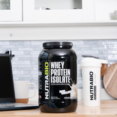 NutraBio Whey Isolate scoop dispensing servings for consistent protein intake.