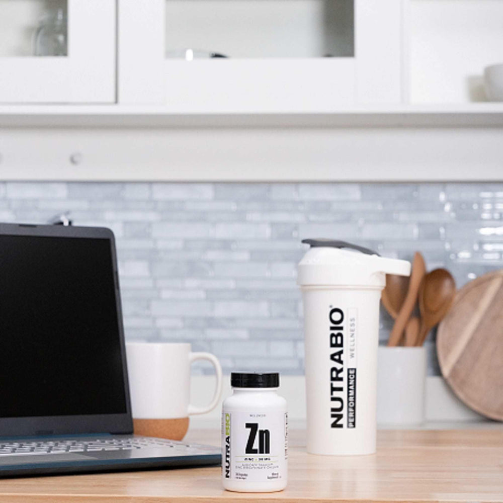 NutraBio Zinc Chelate bottle shown with a meal to illustrate absorption