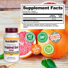NutriBiotic Grapefruit Seed Extract capsules poured into glass, simple daily usage cue.