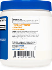 Pouring Nutricost Vitamin C powder into a glass for mixing.