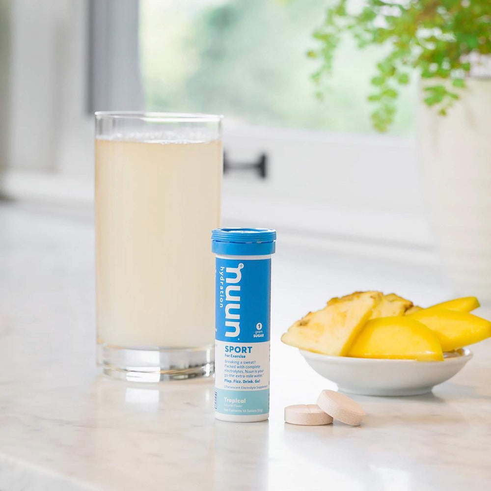 Glass of water with Nuun Active Tropical Fruit tab for refreshed hydration.