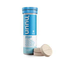 Dissolving Nuun Active Tropical Fruit tab in water for flavorful hydration.