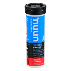 Close-up of Nuun Sport Caffeine Cherry Limeade tablets dissolving for quick hydration.