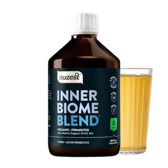 Nuzest Inner Biome Blend liquid in a glass showing convenient daily use.