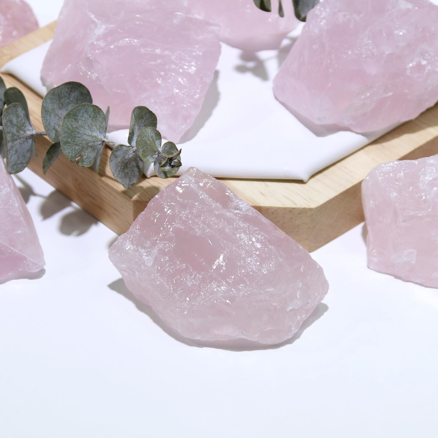 Nvzi rose quartz crystals in a workspace to promote calm focus