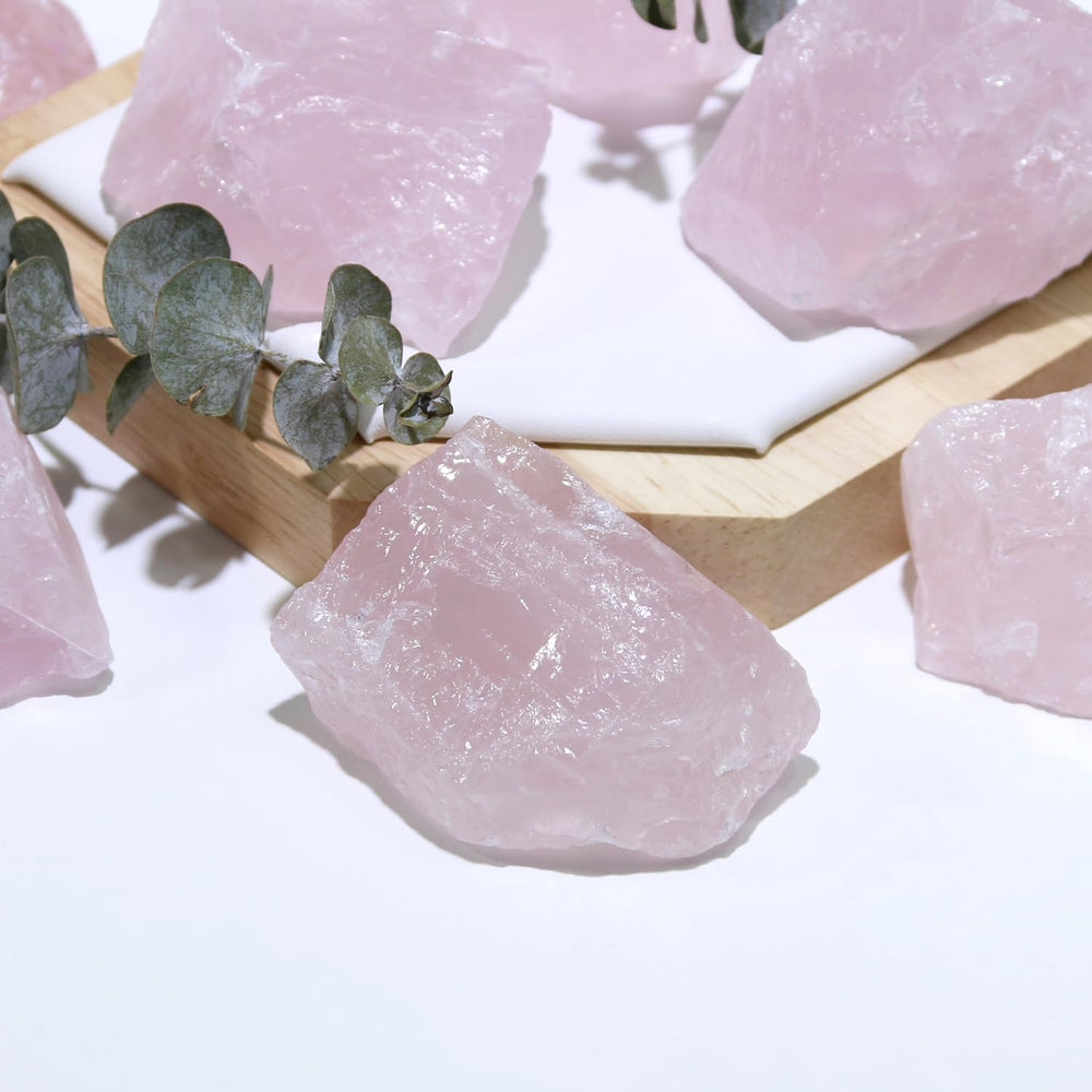 Nvzi rose quartz crystals in a workspace to promote calm focus