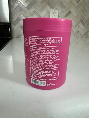O Positiv FLO user taking capsules at home indicates routine