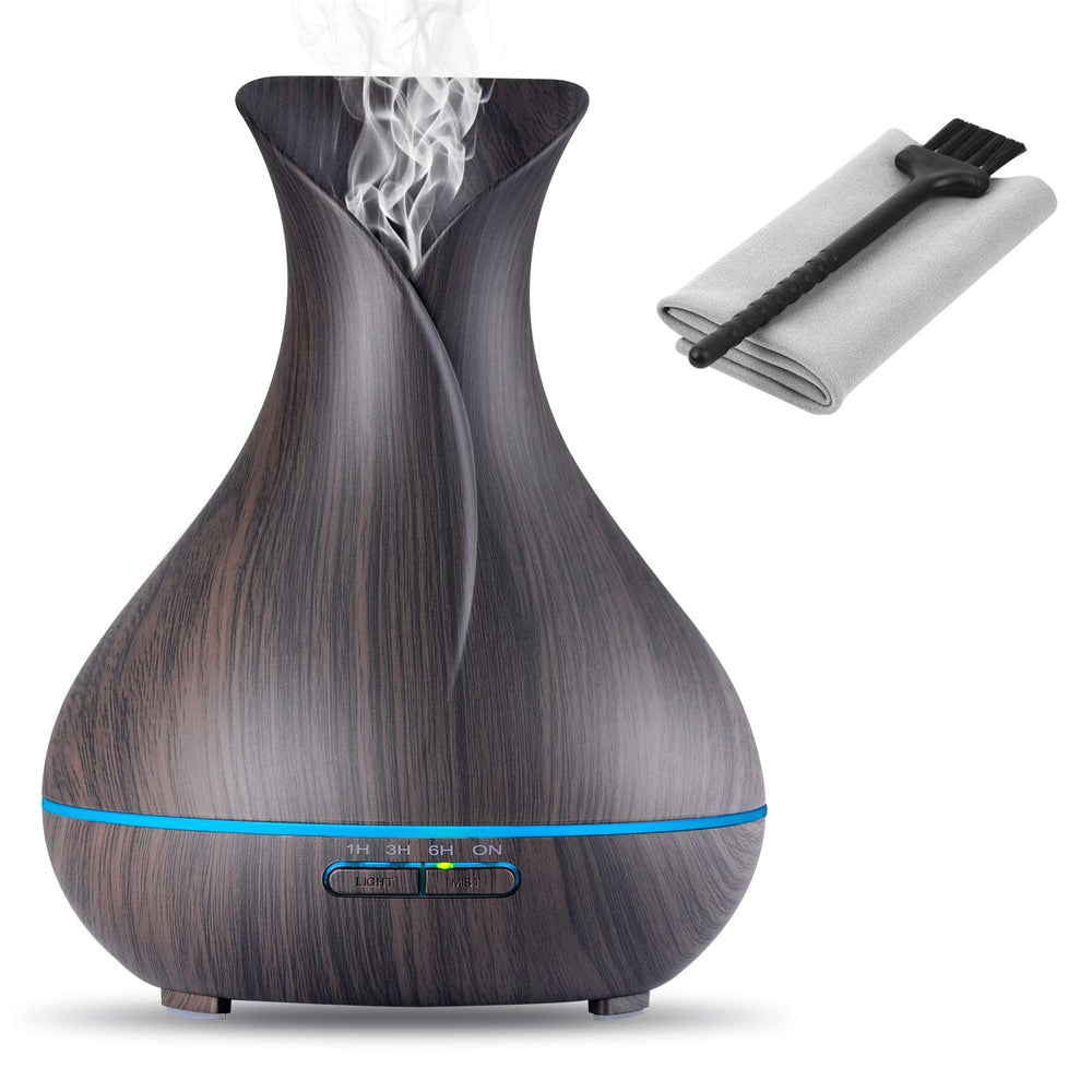 OliveTech Aroma Diffuser with wood grain base releasing a subtle room fragrance